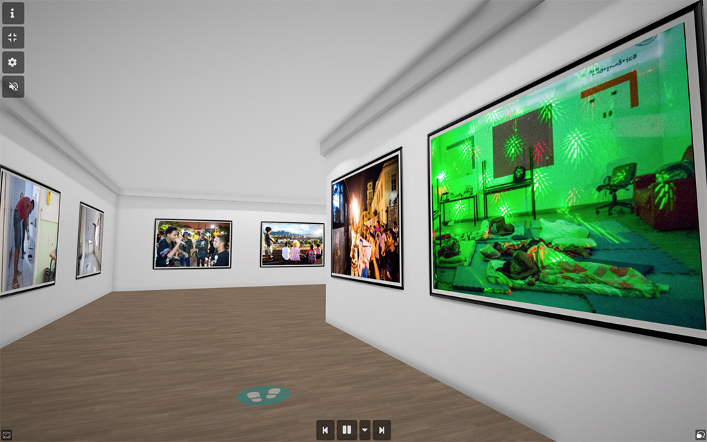 Screenshot of virtual gallery with art hanging on white walls.